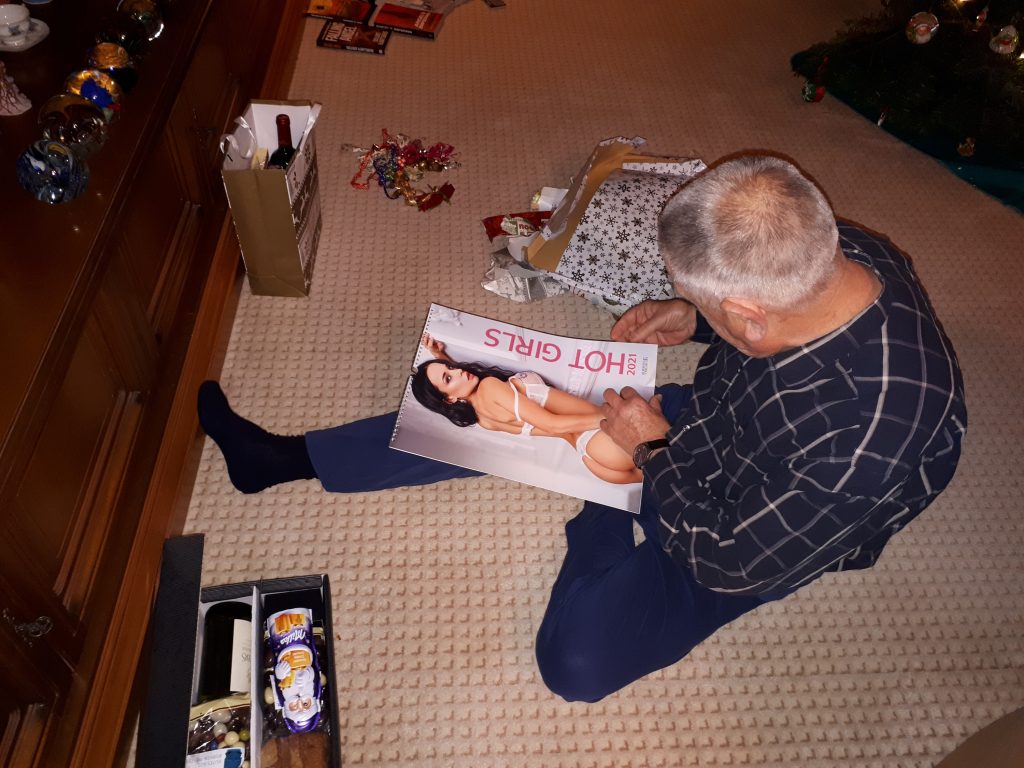 Dad unwrapping Christmas presents