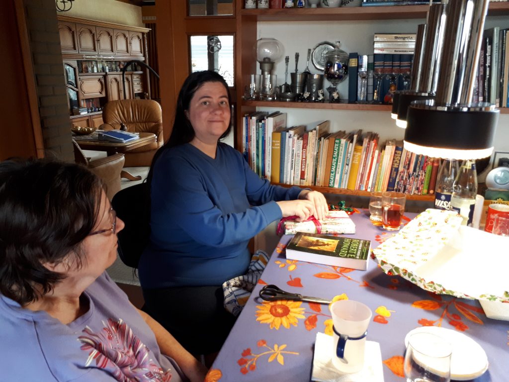 Cora unwrapping birthday presents