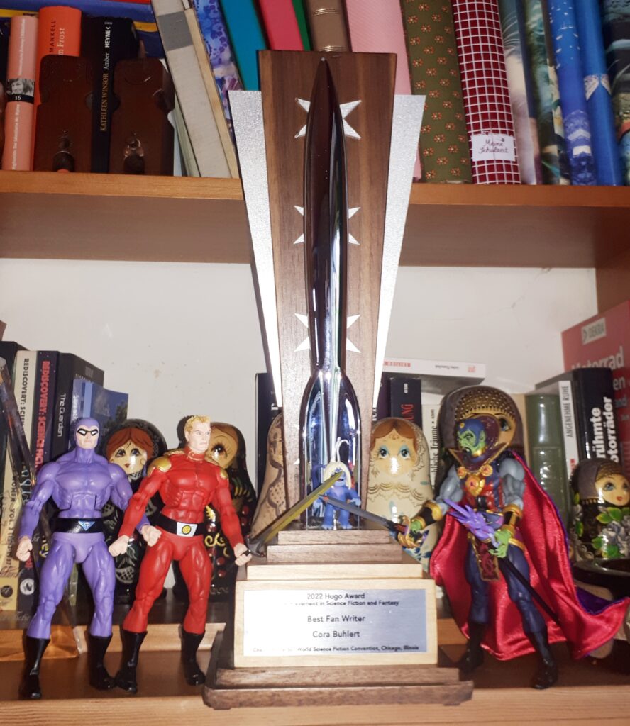 Flash Gordon and Phantom fight Ming the Merciless over the 2022 Hugo trophy.