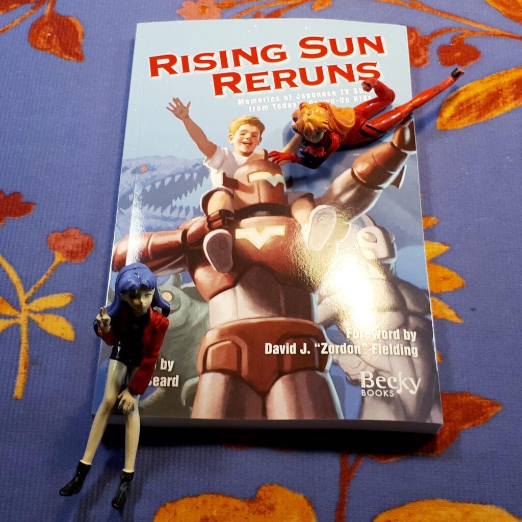 Asuka and Misato from Neon Genesis Evangelion pose with Rising Sun Reruns.