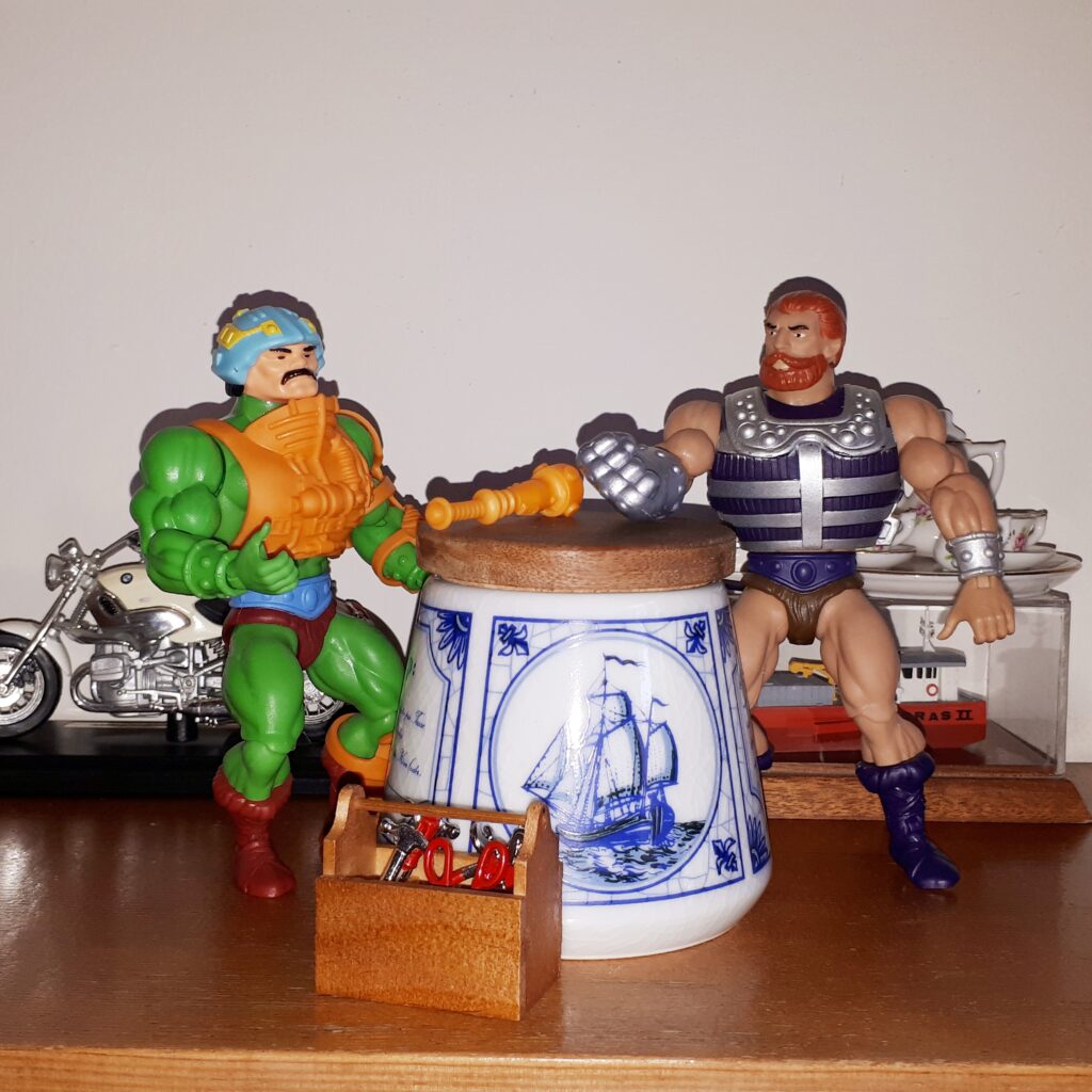 Duncan is tinkering with his mace while Fisto looks on.