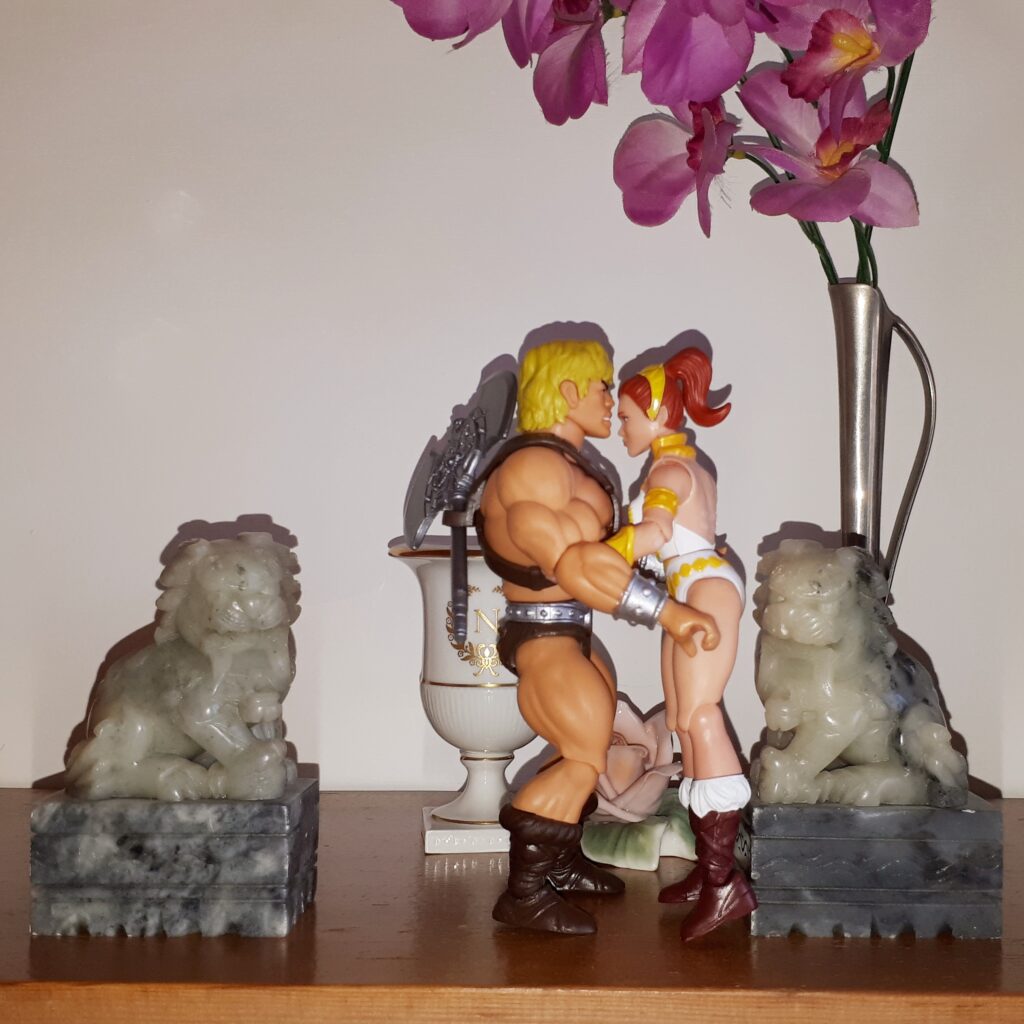 He-Man and Teela kiss in the palace garden.
