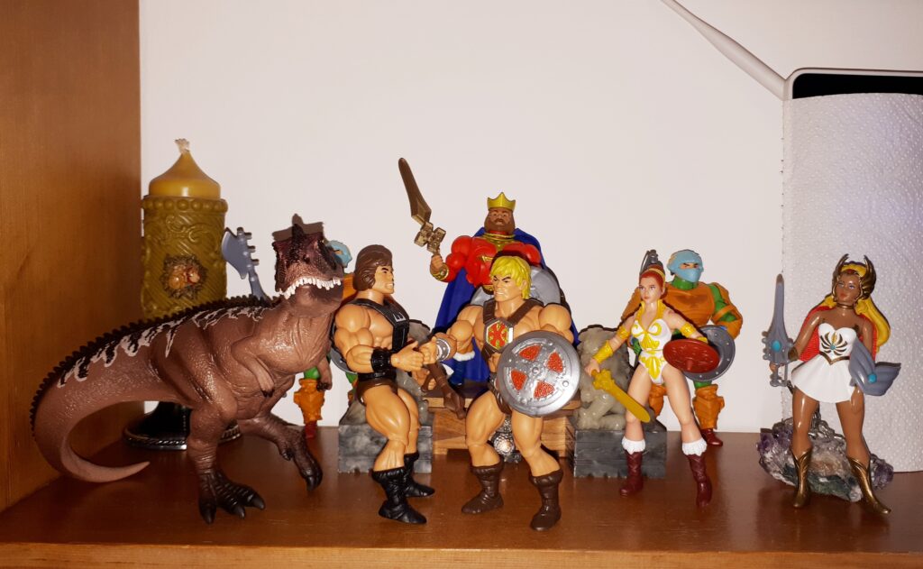 He-Man and Wun-Dar shake hands, while King Randor, Teela and She-Ra look on.