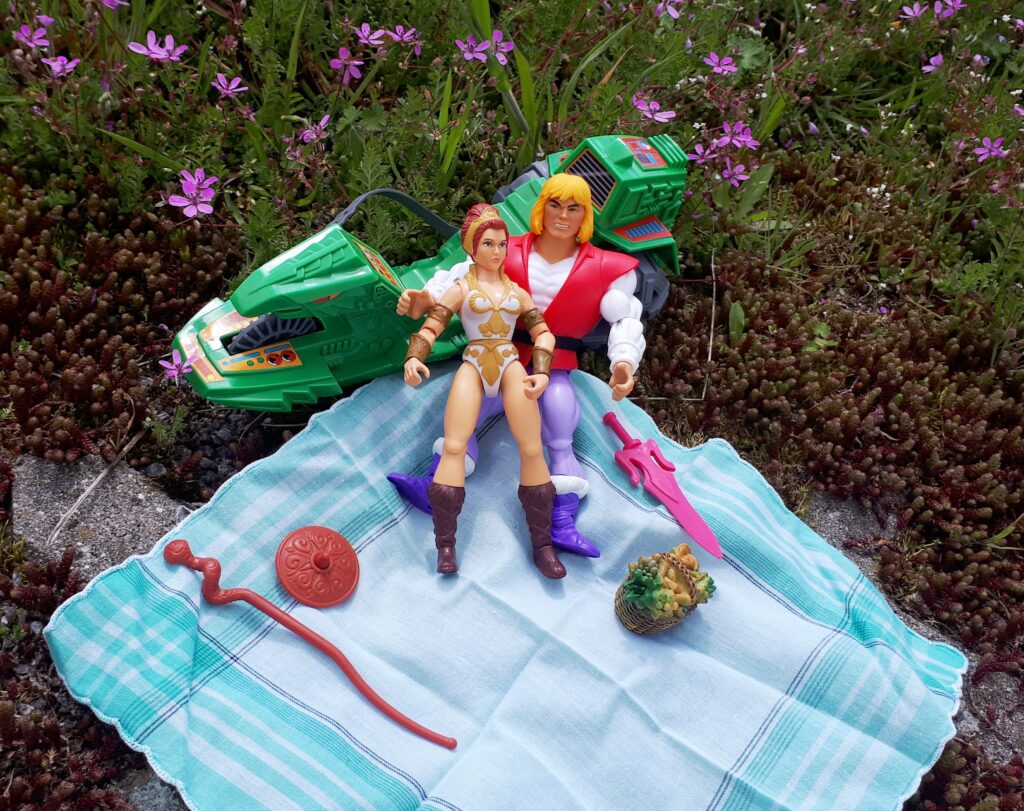 Adam and Teela have a picnic in the wilderness.