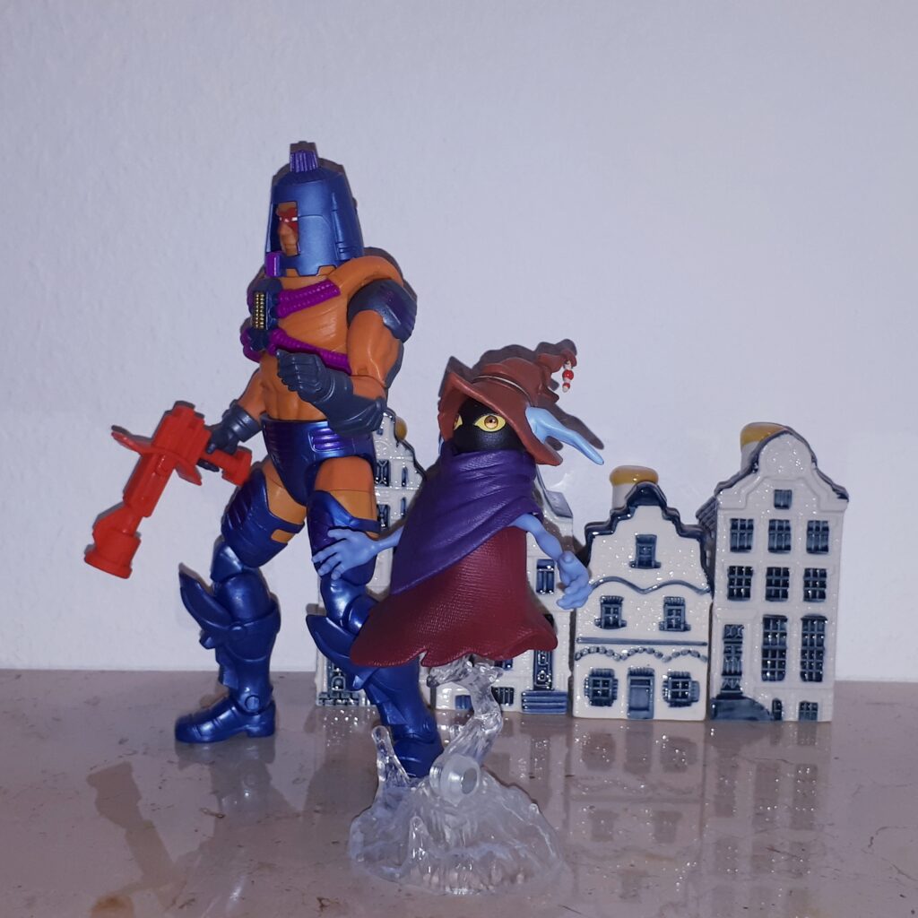 Man-e-Faces and Orko walk through the streets of Sarnscepter.
