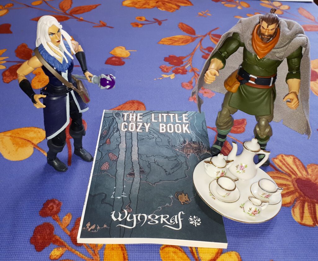 Duncan and Evil-Lyn with The Little Cozy Book