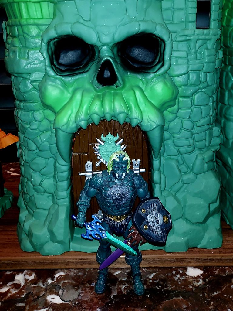 Castle Grayskullman in front of Castle Grayskull