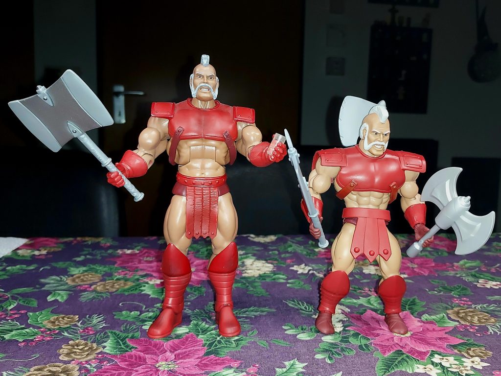 Masters of the Universe Classics and Origins Geldor action figure side by side.