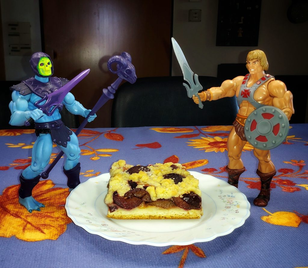 He-Man versus Skeletor over a piece of cake.