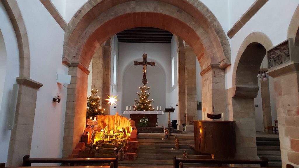 Holy Cross Church interior with nativity and Christmas tree